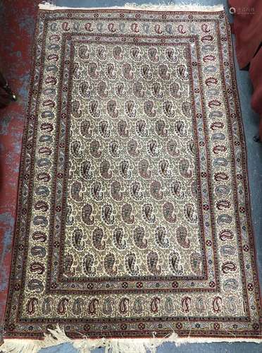 A fine old Persian Veramin rug, the field of repeating multi-coloured stylised boteh