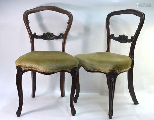 A set of six Victorian walnut framed balloon back dining chairs