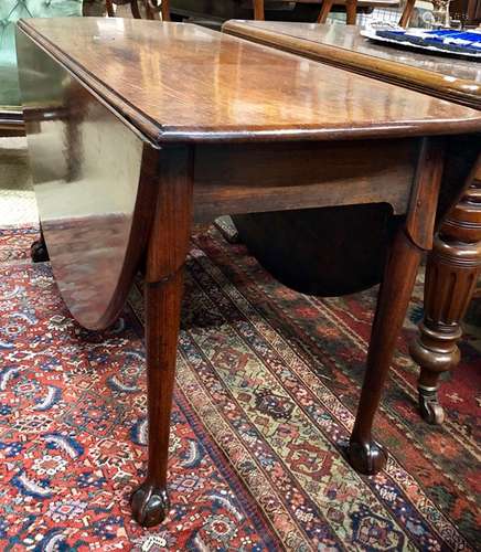 A large George III mahogany drop leaf dining table