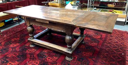 A 17th century and later oak draw-leaf dining table