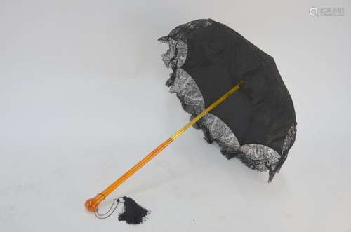 A 19th century French black lace parasol