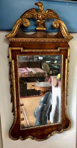 A George III giltwood and walnut architectural mirror