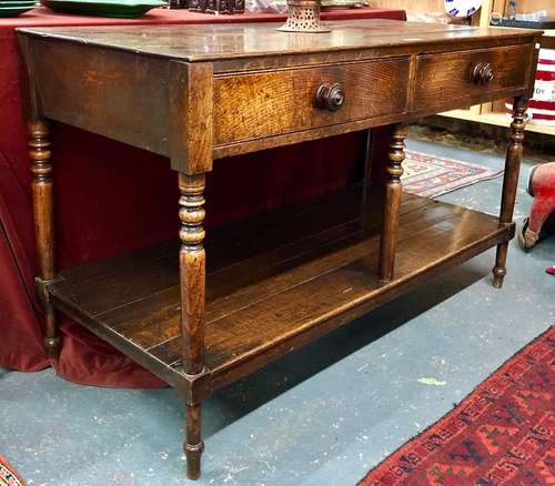 An 18th century oak low dresser