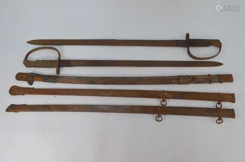 Two British Martini Henry 1879 - pattern sawback sword bayonets