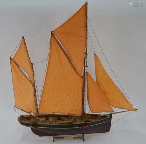 A painted wood model of a Brixham Trawler