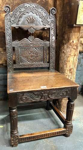 A 17th/18th century carved oak chair