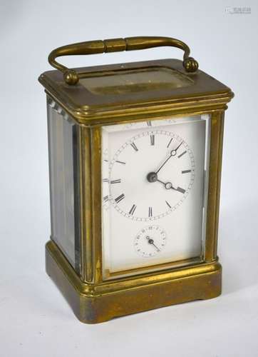 A lacquered brass carriage clock