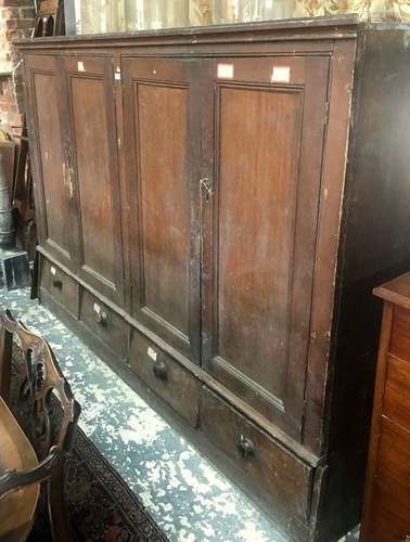 A Victorian scumbled pine four door pantry/housekeeper's cupboard