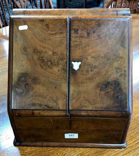 A Victorian walnut slope front stationery box