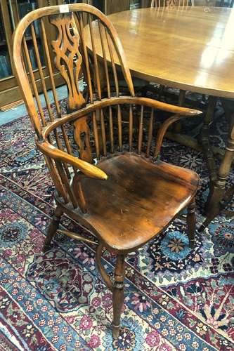 A contemporary set of six Windsor elm seat chairs with crinoline stretchers