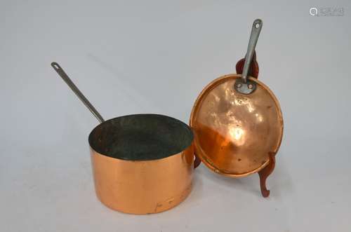 A large vintage copper saucepan and cover