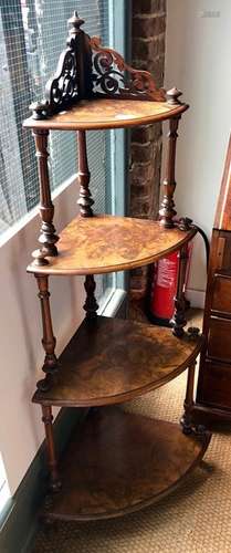 A Victorian walnut graduating four tier corner whatnot