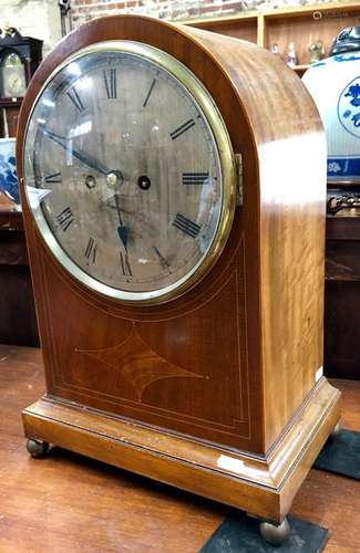 A large mahogany dome cased 8-day clock