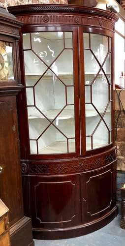 A Georgian mahogany floor standing corner cabinet