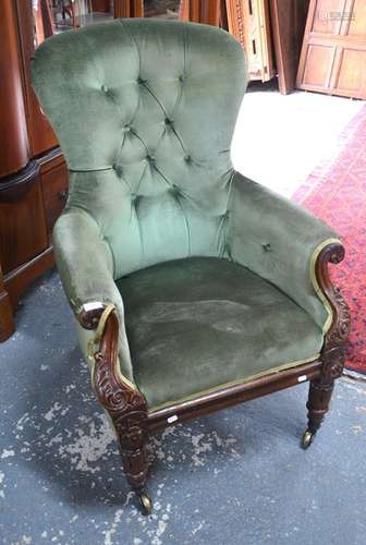 A Victorian carved mahogany armchair with green dralon button back upholstery