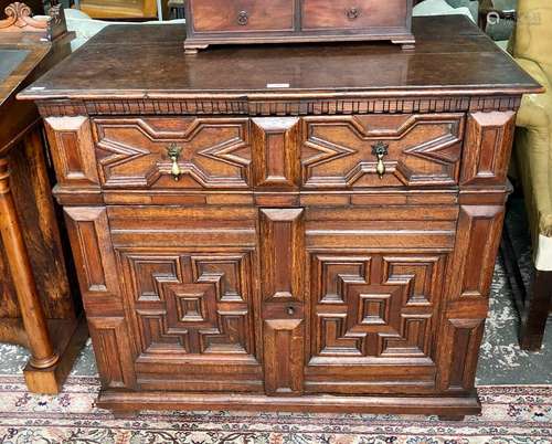 An antique Jacobean style oak chest, in two parts