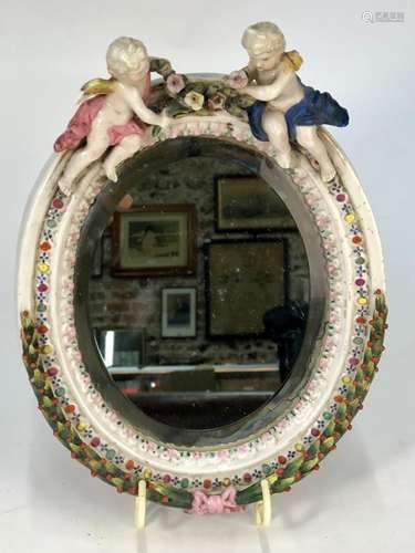 A German porcelain mirror