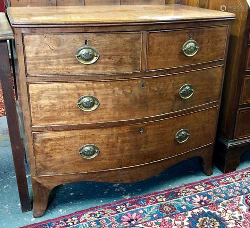 A Georgian mahogany bow-front chest of two short over two long graduated drawers