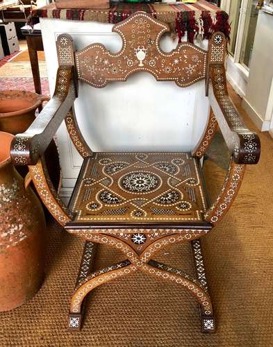 An antique Italian Savonarola chair