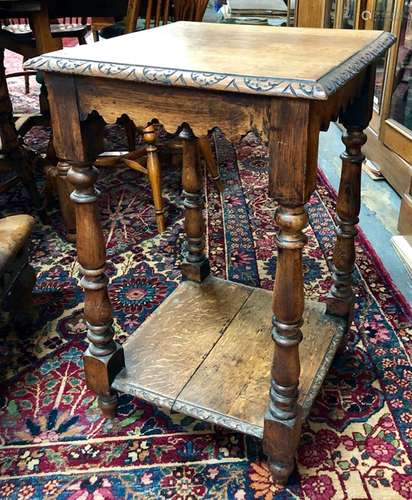 A Victorian square oak hall table with under-tier