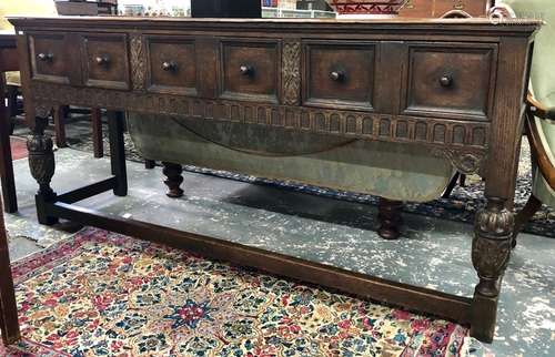 A Victorian oak three drawer low dresser