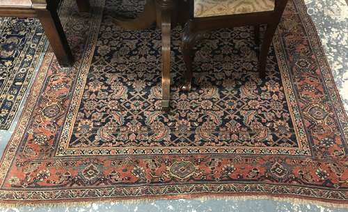 An antique Persian Hamadan kelleh carpet, the all-over repeat design on blue ground