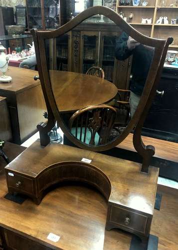 A 19th century inlaid mahogany shield shaped platform mirror