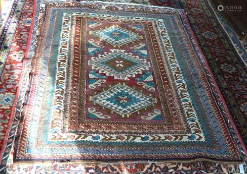 An old Caucasian geometric design rug