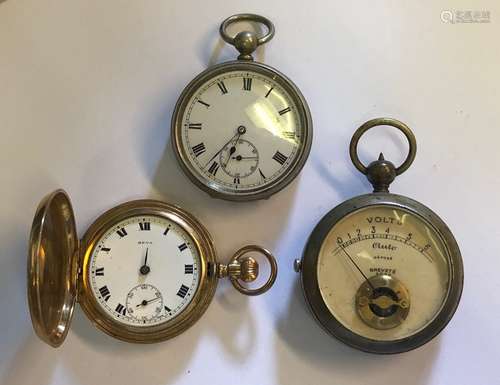 Two pocket watches and a pocket voltmeter