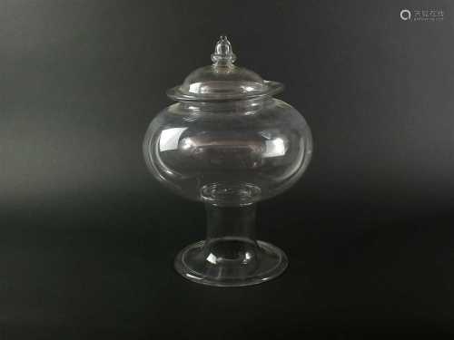 An early 19th century glass leech jar and cover