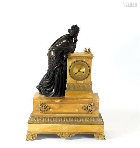 A French bronze ormolu mounted and Sienna marble mantel clock