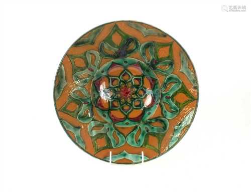 A Della Robbia Art Pottery charger by Liz Wilkins