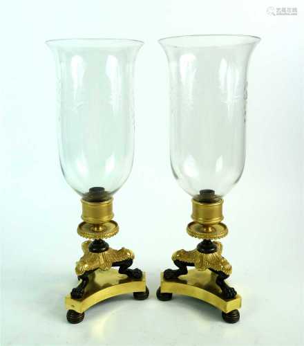 A pair of French Empire bronze, ormolu and gilt brass storm lamps / lanterns