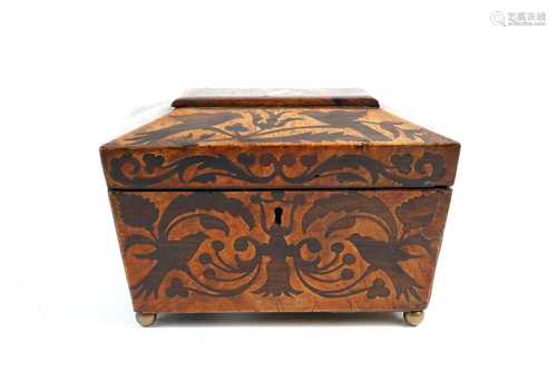 An early 19th century burr walnut veneered sarcophocus shaped tea caddy