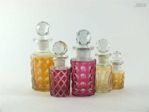 Five Baccarat glass perfume bottles and stoppers