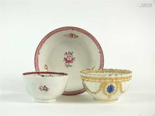 A Caughley polychrome tea bowl and a further polychrome tea bowl and saucer
