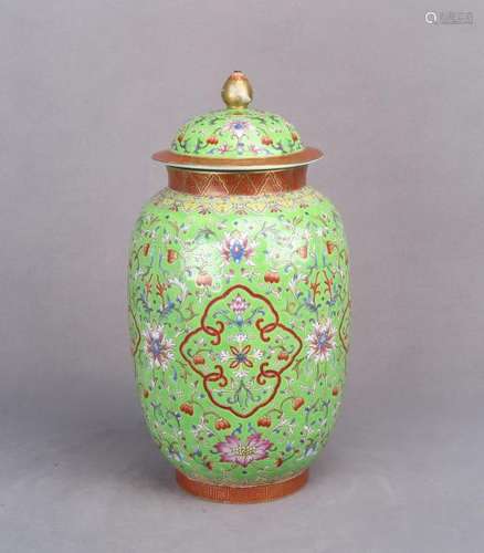 A GREEN GROUND FAMILLE ROSE 'FLOWER' JAR WITH COVER