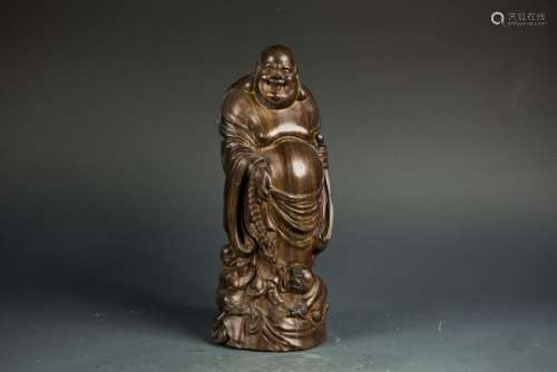 A HARDWOOD CARVED MODEL OF BUDAI