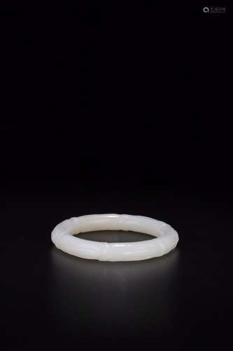 A HETIAN JADE 'JIEJIEGAOSHENG' BANGLE