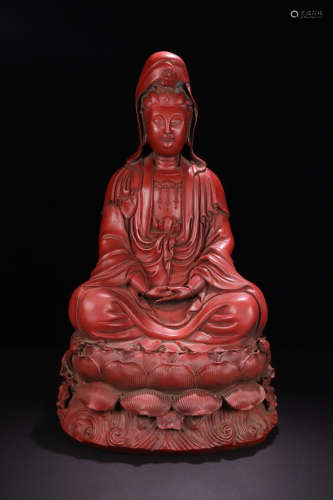 A TIN PAINTED RED GUANYIN FIGURE