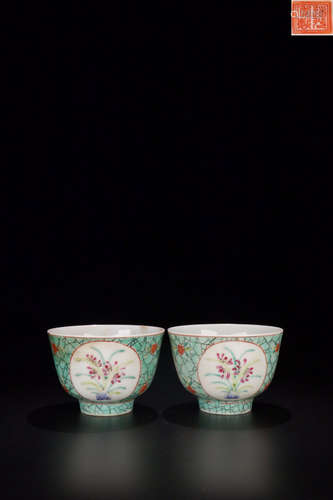 A PAIR OF TURQUOISE GLAZE DAFFODIL PATTERN TEA CUPS