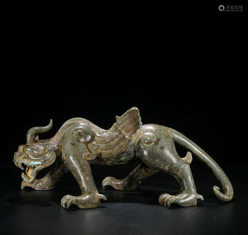 A BRONZE CARVED BEAST ORNAMENT