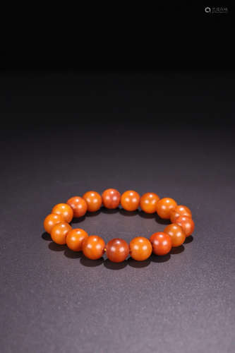 AN AMBER BEADS ROSARY