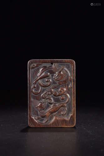 A XITAN WOOD CARVED TIGER PATTERN TABLET