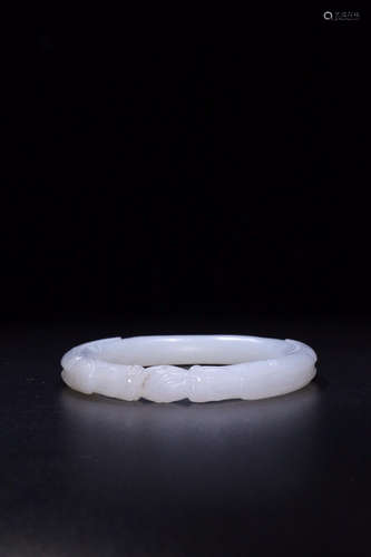 A HETIAN JADE CARVED DRAGON BANGLE