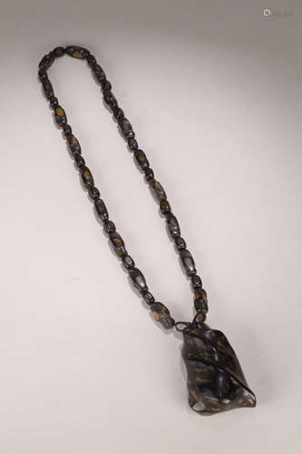 A CHENXIANG WOOD RANDOM SHAPED PENDANT