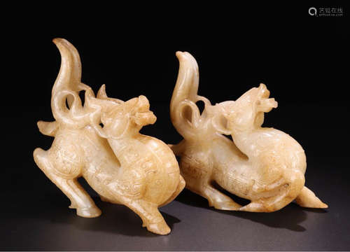 A PAIR OF ANTIQUE JADE DEER SHAPED ORNAMENTS