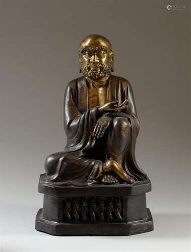 CHINE Statue en bronze représentant un Lohan assis…