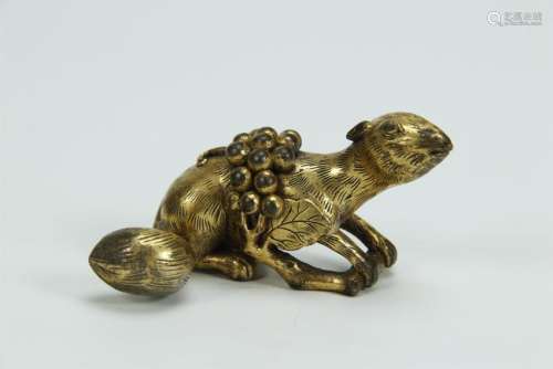 An old gilt bronze paperweight, squirrel form