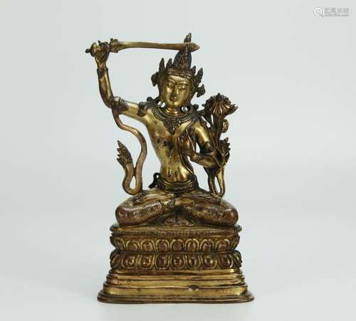 Antique gilt bronze figure of Manjusri Namasamgiti